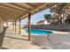 Backyard view of covered patio and pool at 3801 W Mercer Ln, Phoenix, AZ 85029
