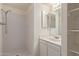 Bathroom with shower, vanity, and built-in shelving at 3801 W Mercer Ln, Phoenix, AZ 85029