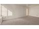 Simple bedroom with neutral carpeting and window coverings at 3801 W Mercer Ln, Phoenix, AZ 85029