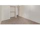 Simple bedroom with neutral carpeting and closet at 3801 W Mercer Ln, Phoenix, AZ 85029