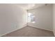 Simple bedroom with neutral carpeting and window at 3801 W Mercer Ln, Phoenix, AZ 85029