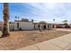 Single-story house with carport and landscaped yard at 3801 W Mercer Ln, Phoenix, AZ 85029