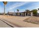 Single-story house with carport and landscaped yard at 3801 W Mercer Ln, Phoenix, AZ 85029