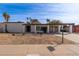 Single-story house with carport and landscaped yard at 3801 W Mercer Ln, Phoenix, AZ 85029