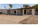 Single-story house with carport and landscaped yard at 3801 W Mercer Ln, Phoenix, AZ 85029