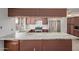 Kitchen with wood cabinets and granite countertops at 3801 W Mercer Ln, Phoenix, AZ 85029