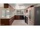 Spacious kitchen with granite countertops and stainless steel appliances at 3801 W Mercer Ln, Phoenix, AZ 85029