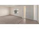 Living room with carpeted floor and large window at 3801 W Mercer Ln, Phoenix, AZ 85029