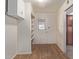 Bright pantry with wood laminate flooring and ample shelving at 3801 W Mercer Ln, Phoenix, AZ 85029