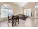 Small dining area with a table and four chairs next to living room at 4338 E Woodridge Dr, Phoenix, AZ 85032