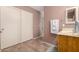 Simple bathroom with single sink and wood vanity at 45707 W Barbara Ln, Maricopa, AZ 85139