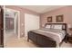 Comfortable bedroom with a double bed and access to hallway at 45707 W Barbara Ln, Maricopa, AZ 85139