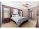 Bright bedroom featuring a king-size bed and ensuite access at 45707 W Barbara Ln, Maricopa, AZ 85139