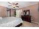 Large bedroom with a dresser and access to another room at 45707 W Barbara Ln, Maricopa, AZ 85139
