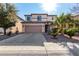 Two story home with attached garage and landscaping at 45707 W Barbara Ln, Maricopa, AZ 85139