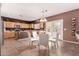 Kitchen features an island, stainless steel appliances, and wood cabinets at 45707 W Barbara Ln, Maricopa, AZ 85139