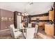 Bright kitchen with island, stainless steel appliances, and wood cabinets at 45707 W Barbara Ln, Maricopa, AZ 85139