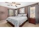 Spacious main bedroom with king-size bed and ceiling fan at 45707 W Barbara Ln, Maricopa, AZ 85139