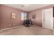 Home office with a desk, chair, and plenty of natural light at 45707 W Barbara Ln, Maricopa, AZ 85139
