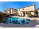 Inviting backyard pool with patio furniture and lush landscaping at 45707 W Barbara Ln, Maricopa, AZ 85139