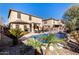 Relaxing backyard oasis featuring a sparkling pool and desert landscaping at 45707 W Barbara Ln, Maricopa, AZ 85139