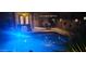 Night view of backyard pool and patio furniture at 45707 W Barbara Ln, Maricopa, AZ 85139