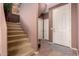 Staircase with carpet runner and access to upper level at 45707 W Barbara Ln, Maricopa, AZ 85139