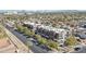 This is an aerial view of brick apartment buildings on a tree-lined street with mountains in the background at 475 N 9Th St # 115, Phoenix, AZ 85006