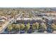 This is an aerial view of brick apartment buildings on a tree-lined street in a busy city at 475 N 9Th St # 115, Phoenix, AZ 85006