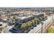 This is an aerial view of brick apartment buildings on a tree-lined street at 475 N 9Th St # 115, Phoenix, AZ 85006