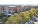 This is a brick apartment building with metal awnings and second-story balconies at 475 N 9Th St # 115, Phoenix, AZ 85006