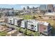 Modern townhomes with brick and white siding, balconies and parking, in a vibrant urban setting at 475 N 9Th St # 115, Phoenix, AZ 85006