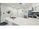 Bright kitchen featuring white cabinetry, modern appliances, and elegant tile backsplash at 475 N 9Th St # 115, Phoenix, AZ 85006