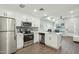 Modern kitchen with stainless steel appliances, sleek countertops, and seamless connection to the living area at 475 N 9Th St # 115, Phoenix, AZ 85006