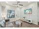Bright living room boasts modern furnishings, sleek flooring, and a ceiling fan for added comfort at 475 N 9Th St # 115, Phoenix, AZ 85006