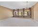 Bright dining room with large windows overlooking the pool at 4840 E Dale Ln, Cave Creek, AZ 85331