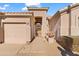 Front entrance with gated courtyard and tan stucco exterior at 4840 E Dale Ln, Cave Creek, AZ 85331