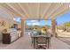 Covered patio features a built-in grill and dining area with pool views at 4840 E Dale Ln, Cave Creek, AZ 85331