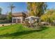 House exterior featuring a lush lawn, gazebo, and mature trees at 5131 N 18Th St, Phoenix, AZ 85016