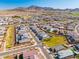 Aerial view of neighborhood and mountains at 5323 W Chuck Box Rd, Laveen, AZ 85339