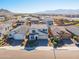 Two-story house, neighborhood view, mountains in background at 5323 W Chuck Box Rd, Laveen, AZ 85339