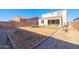 Large backyard with gravel, grass, and trampoline at 5323 W Chuck Box Rd, Laveen, AZ 85339