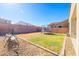 Backyard with grass, trampoline, and a swing set at 5323 W Chuck Box Rd, Laveen, AZ 85339
