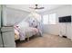 Bedroom with a canopy bed, TV, and carpeted floors at 5323 W Chuck Box Rd, Laveen, AZ 85339