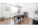 Bright dining room with wooden table and black chairs at 5323 W Chuck Box Rd, Laveen, AZ 85339