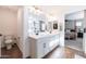 Main bathroom with a dual vanity, walk-in shower, and toilet at 5323 W Chuck Box Rd, Laveen, AZ 85339