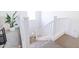 White staircase with carpeted steps and white railing at 5323 W Chuck Box Rd, Laveen, AZ 85339