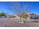 Large backyard with gravel landscaping and mature trees at 6337 E Evergreen St, Mesa, AZ 85205