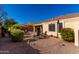 Relaxing backyard patio with brick pavers, seating area, and mature landscaping at 695 E Mule Train Trl, San Tan Valley, AZ 85143