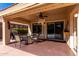 Covered patio with seating area, ceiling fan, and string lights at 695 E Mule Train Trl, San Tan Valley, AZ 85143